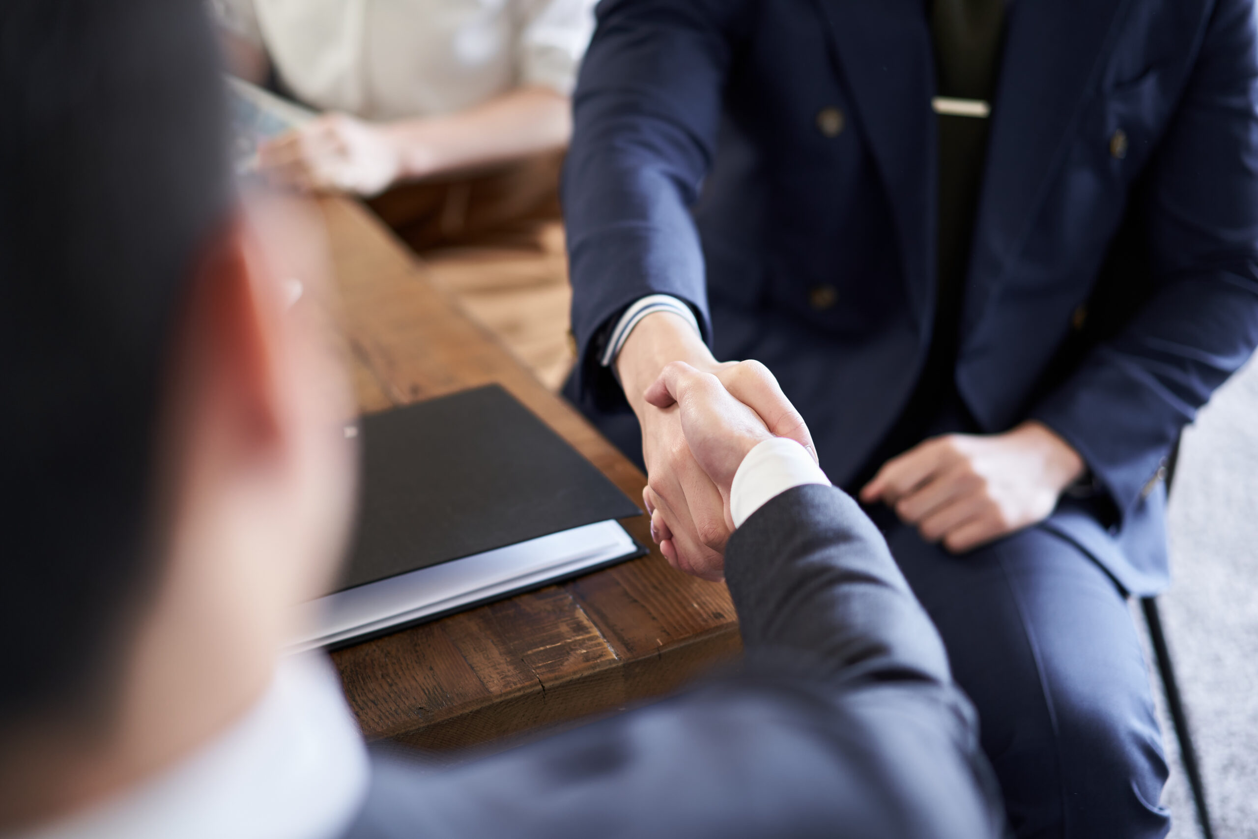 Asian businessman shaking hands in business talks